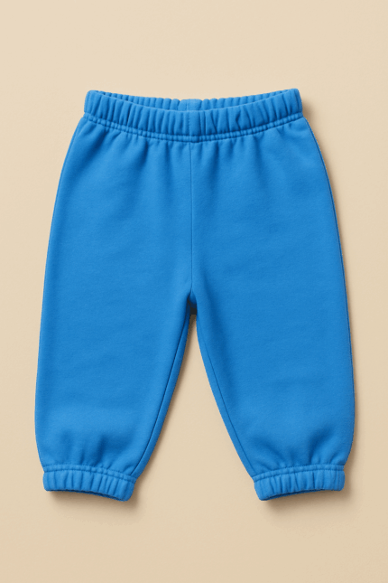 A plain blue baby joggers or sweatpants with an elasticated waistband and cuffed ankles