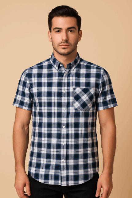 A short-sleeve navy and white plaid or checked button-up shirt stands facing forward.