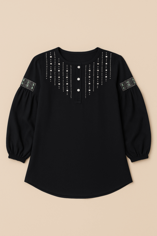 A black long-sleeved tunic top with embroidered details on the yoke and patterned accents on the puffed sleeves.