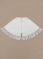 White Knit Fringe Cape Sweater with front button closure and decorative fringe detailing on a neutral background.
