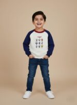 Kids sweatshirt with navy sleeves, maroon neckline, and cartoon space characters printed on white cotton fabric.