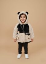 Child wearing panda hoodie with ears and plush toy bag – cozy kids winter outfit.