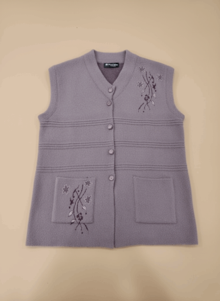 Lilac women's knitted sweater vest with embroidered floral design on chest and pockets, button-front closure, V-neck, sleeveless.