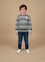 Flat lay of boys striped winter sweater with ribbed cuffs and hem.