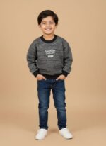 Boy wearing a grey kids sweater with black neckline, cuffs, and “DoteRoom 1989” text on the front.