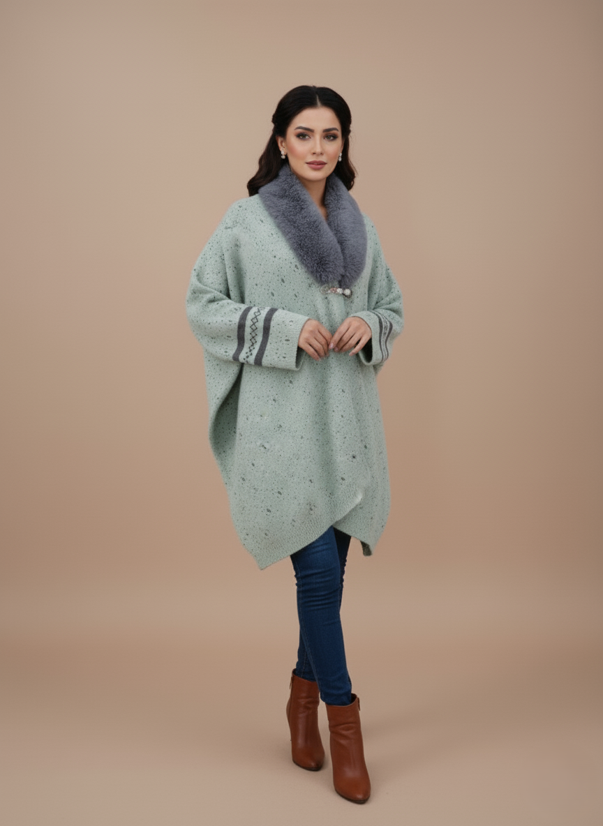 Women's Faux Fur Collar Sweater Mint green women's knit sweater with a grey faux fur collar and dark patterned accents.