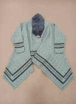 Mint green women's knit sweater with a grey faux fur collar and dark patterned accents.