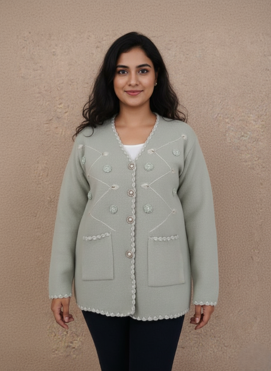 Women's Sage Green Embellished Cardigan Sweater Women's sage green V-neck embellished button-front cardigan sweater with scallop trim and front pockets on a light brown background.