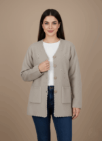 Light beige women's button-front sweater with decorative embroidery, two front pockets, and scalloped edges on a neutral background.