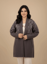 Women's dark gray open-front alpaca sweater with light gray geometric knit patterns and a decorative pin.