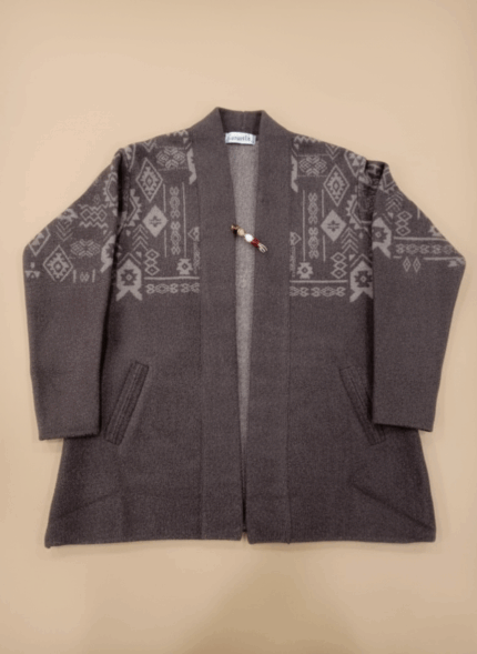 Women's dark gray open-front alpaca sweater with light gray geometric knit patterns and a decorative pin.
