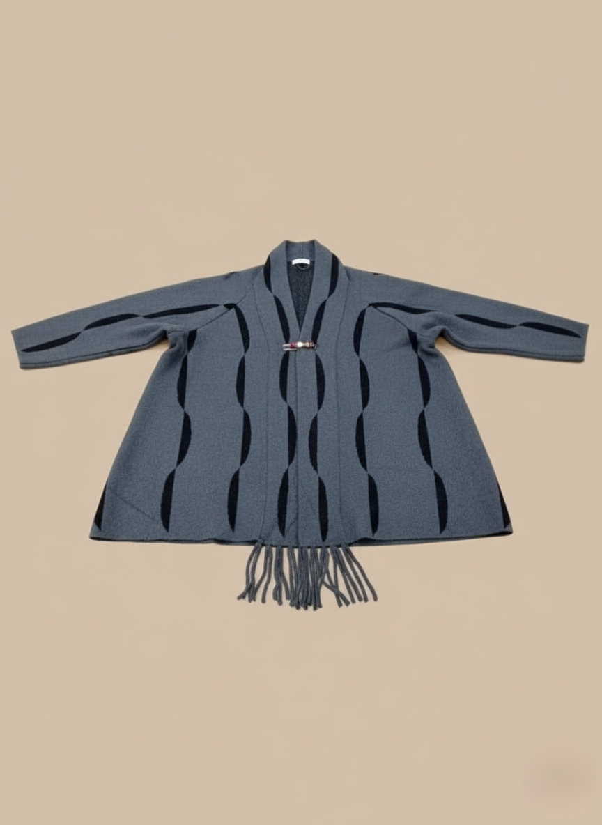 Women's grey kimono sweater with black wave pattern and fringe, front view, open-front knit, toggle closure.