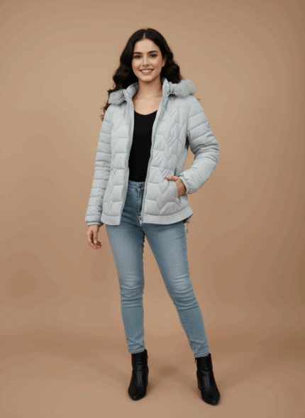 Light grey women's hooded puffer jacket with faux fur trim, quilted design, and zippered pockets.