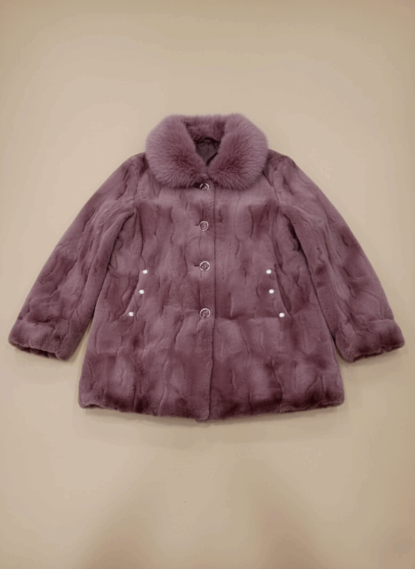 Women's lavender mink fur coat with fox fur collar, elegant button closure, and subtle pockets, ideal for winter luxury and warmth.