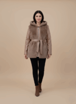 Women's hooded faux fur and leather belted jacket with brown faux fur body and brown leather sleeves on a light background.
