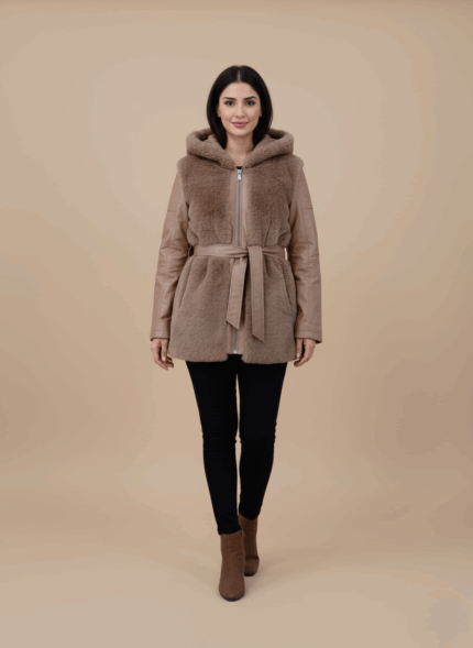 Women's hooded faux fur and leather belted jacket with brown faux fur body and brown leather sleeves on a light background.