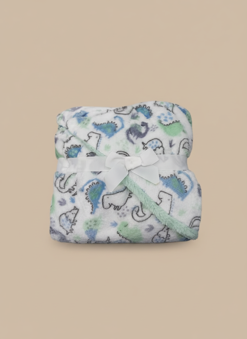 Soft dinosaur-print baby blanket made of fleece, folded with ribbon, ideal for newborn comfort.