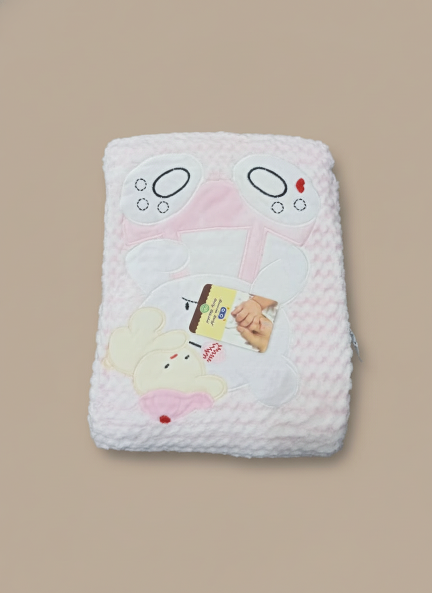 Soft pink baby blanket with bear design for newborns and infants.