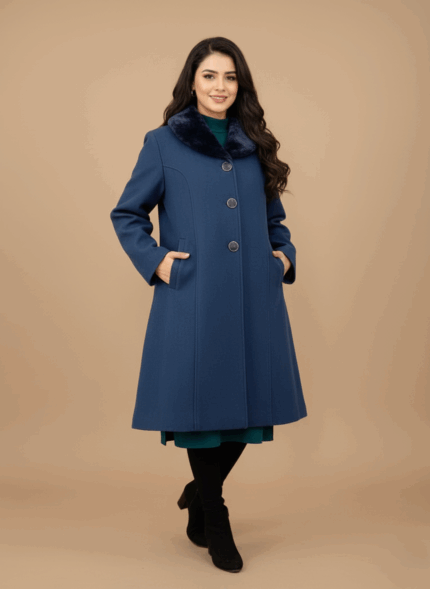 Women's blue wool coat featuring a black faux fur collar, three large dark buttons down the front, and a flared A-line cut, displayed on a light brown background.