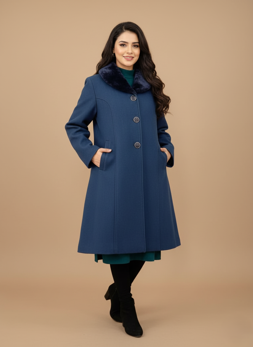 Women's Blue Wool Coat Women's blue wool coat featuring a black faux fur collar, three large dark buttons down the front, and a flared A-line cut, displayed on a light brown background.