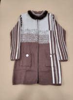 Women's brown and white striped winter sweater with faux fur collar and white buttons on front pockets.