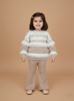 Beige striped girls sweater set with ribbed knit pants on flat background.