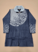 Women's knit sweater with light blue faux fur collar and abstract grey and blue pattern, long sleeve cardigan style.