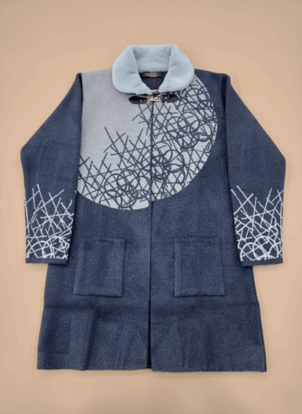 Women's knit sweater with light blue faux fur collar and abstract grey and blue pattern, long sleeve cardigan style.