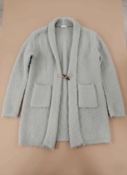 Grey fuzzy knit sweater for women, featuring a toggle closure, soft texture, shimmer, and front pockets.