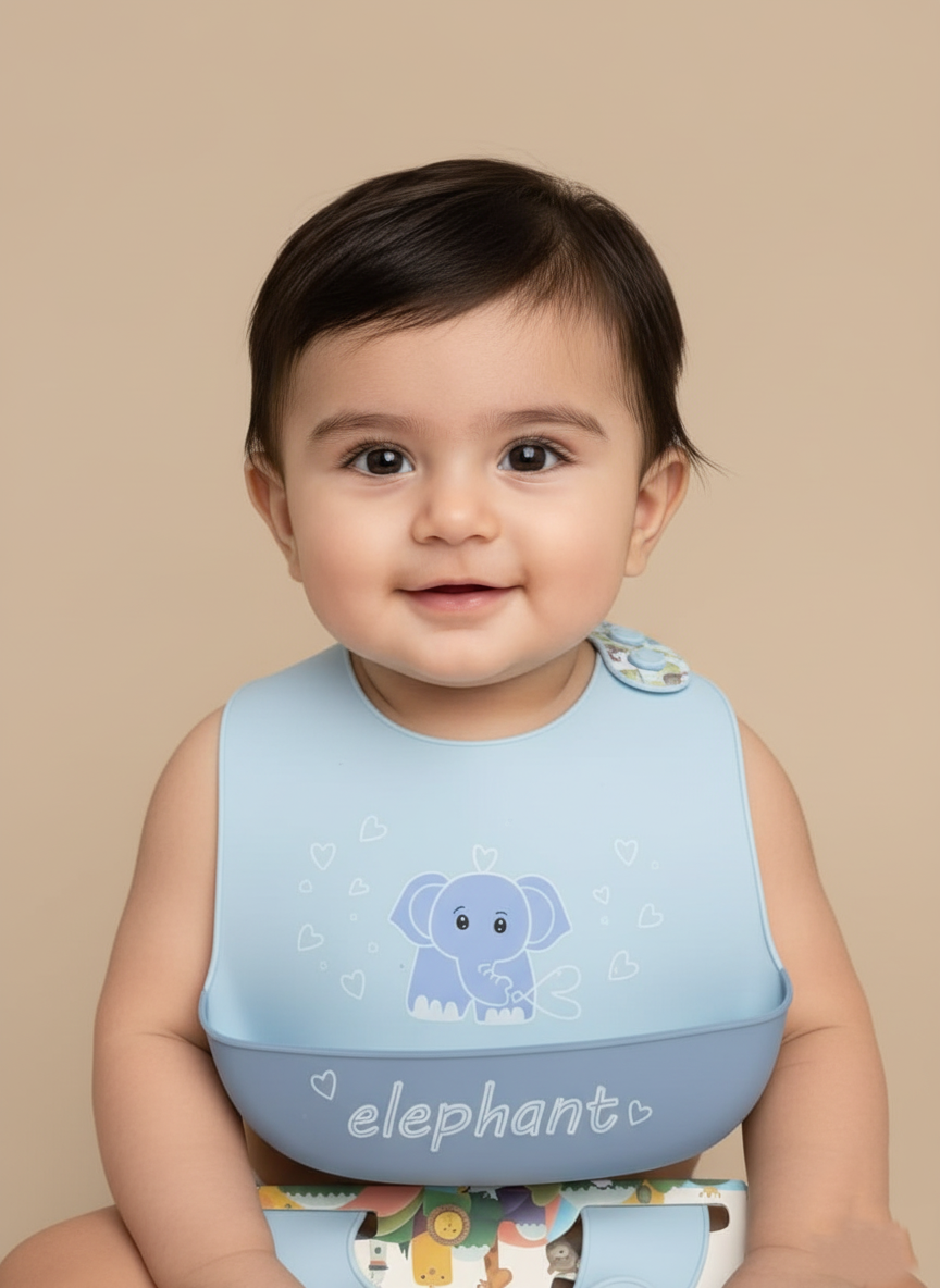 Adorable Elephant Silicone Baby Bib with Food Catcher A happy baby wearing a light blue silicone bib with an elephant design and a food catcher, ready for mealtime.