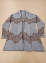 Women's long open-front sweater, light grey knit with brown pattern, long sleeves, open front, two pockets, decorative clasp, cozy, fall winter fashion.