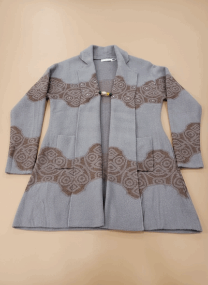 Women's long open-front sweater, light grey knit with brown pattern, long sleeves, open front, two pockets, decorative clasp, cozy, fall winter fashion.
