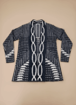 Women's black and white patterned open-front sweater with long sleeves and a prominent decorative link design down the center. The sweater features geometric and stripe patterns, perfect for a stylish women's sweater collection.