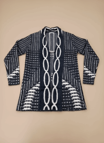 Women's black and white patterned open-front sweater with long sleeves and a prominent decorative link design down the center. The sweater features geometric and stripe patterns, perfect for a stylish women's sweater collection.