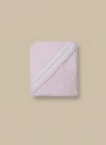 A folded pink baby hooded towel with white stripes on the hood, made from a plush, soft fabric.