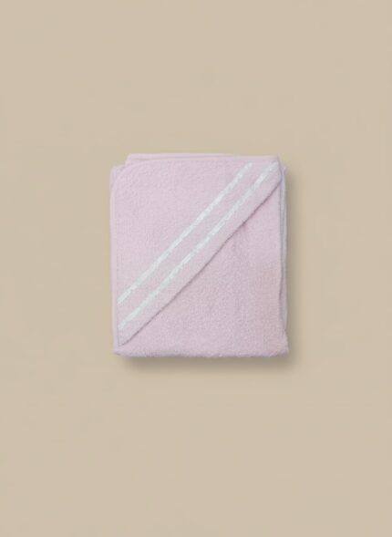 A folded pink baby hooded towel with white stripes on the hood, made from a plush, soft fabric.