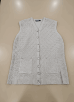 Light gray women's sweater vest with diamond knit pattern, clear decorative buttons down the front, and two front pockets, laid flat on a beige background.
