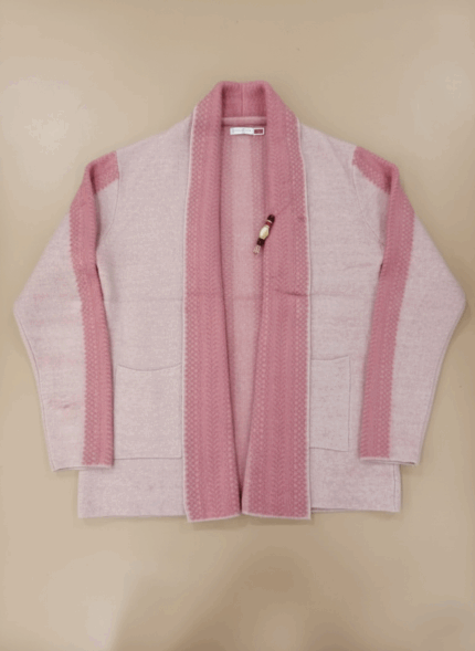 A light pink open-front cardigan sweater featuring darker pink ribbed trim along the collar, placket, and shoulders, with two front patch pockets, laid flat on a light background.