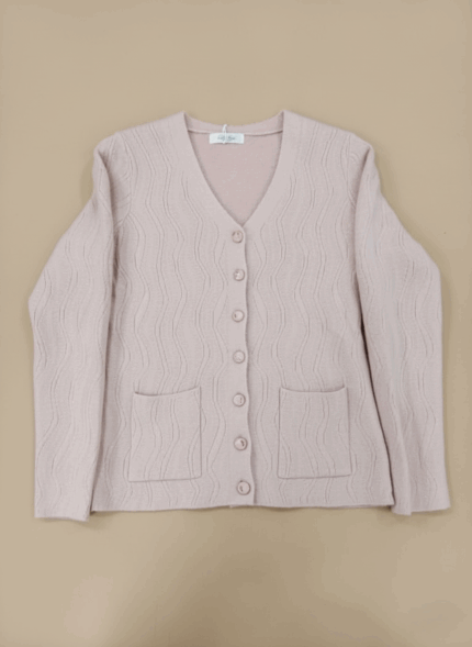 Light pink ribbed knit women's cardigan sweater with V-neck, button front, and two patch pockets.
