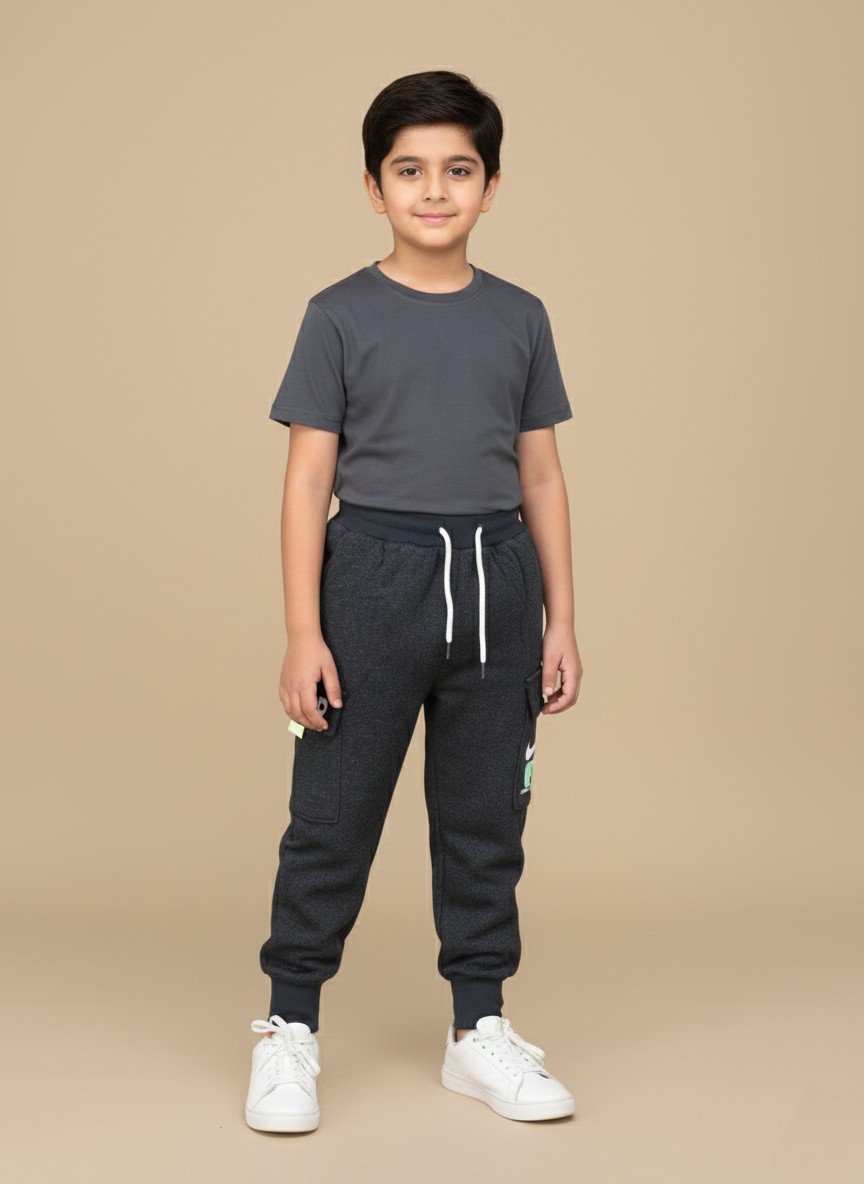 Premium Boys Cargo Jogger Pants Kid wearing dark grey boys cargo jogger pants styled with a t-shirt and sneakers.