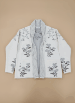 Women's elegant ivory floral knit cardigan sweater with grey embroidered flowers and an open front, displayed on a neutral background.
