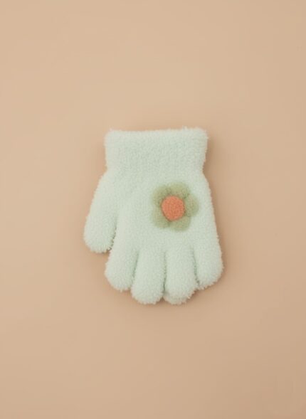 A close-up of a single mint green plush kids mitten with a green and orange flower appliqué.