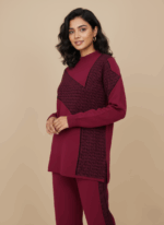 Women's burgundy geometric knit sweater and matching skirt set, flat lay.