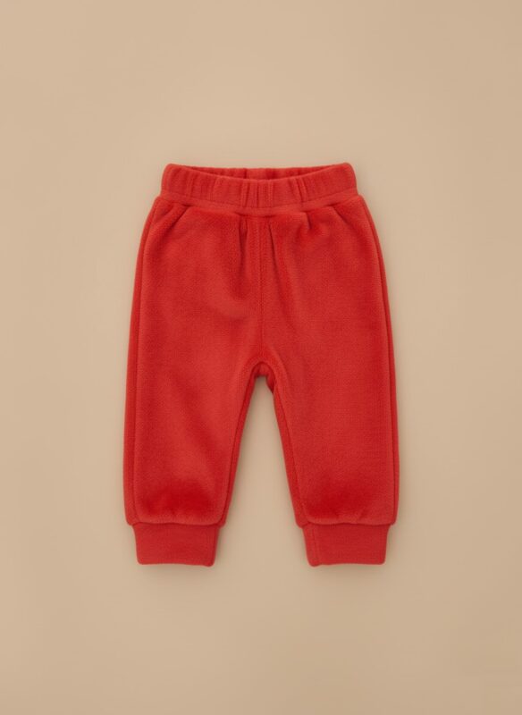 A single pair of bright red toddler fleece pants with an elastic waistband and ribbed cuffs, laid flat on a neutral background.