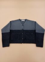 Women's two-tone knit button-up sweater, grey and dark grey, with white stitching and front pockets