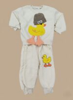 Cream boys sweater set with yellow duck print laid flat on beige background