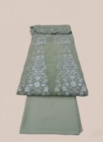 ALTAN Virsa Emerald Luxury Wedding Collection Embroidered Net Suit in emerald green, with intricate light blue and silver embroidery on net kali, sheer embroidered net sleeves, and a matching embroidered dupatta, worn by a female model.