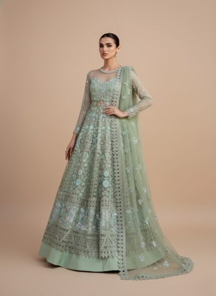 ALTAN Virsa Emerald Luxury Wedding Collection Embroidered Net Suit in emerald green, with intricate light blue and silver embroidery on net kali, sheer embroidered net sleeves, and a matching embroidered dupatta, worn by a female model.