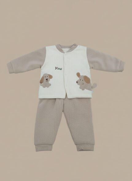 Baby wearing a beige and cream ribbed winter sweater set with puppy embroidery, sitting on a light background.