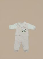 Happy baby wearing a pink Baby Panda Sweater Set with a "Panda" bib, featuring a cute panda design on the sweater.